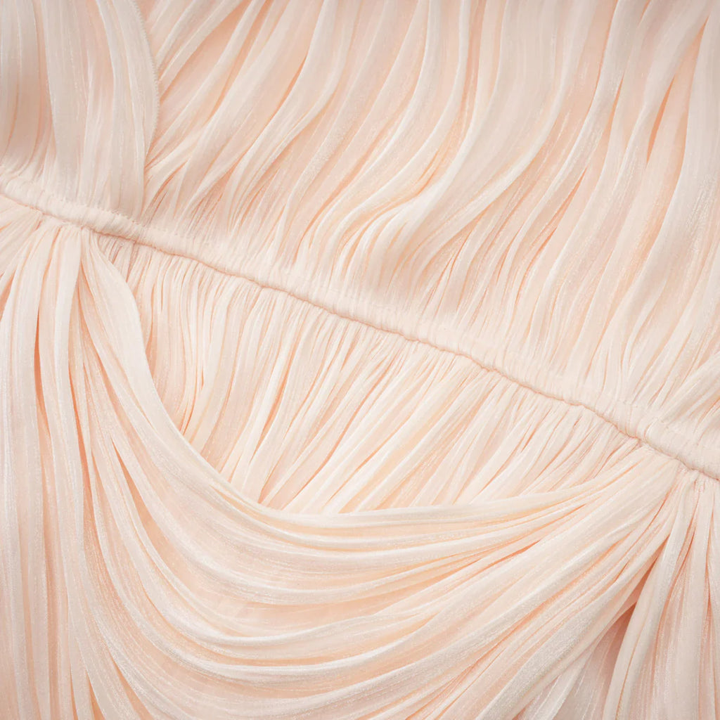 Minivestido plisado con volantes en tonos neutros de Halvard